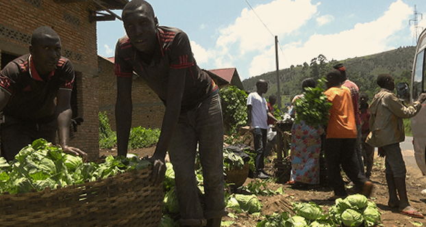 Family outside a repaired house
